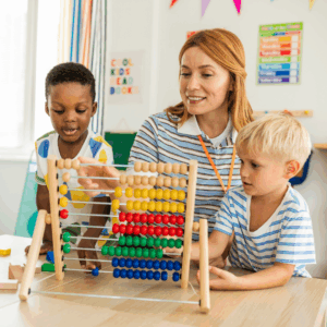 Early childhood educator supporting children through play based learning activities
